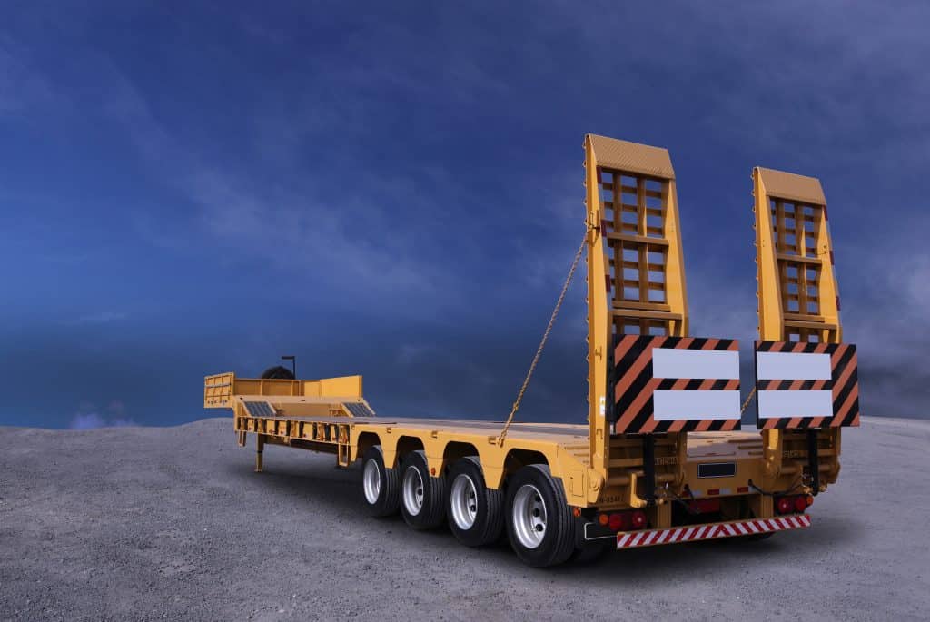 A detached yellow truck trailer.