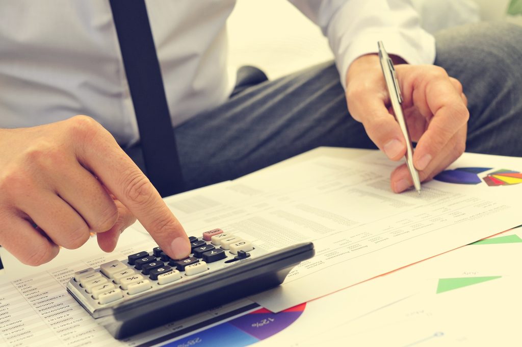 Closeup of a young man checking accounts