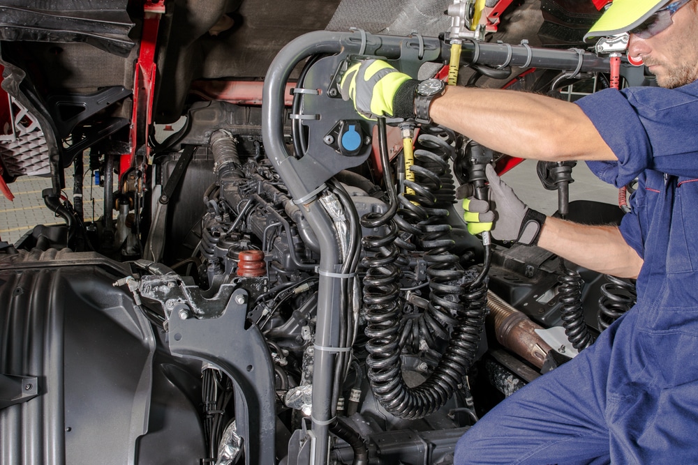 A driver installing an ELD on his truck.