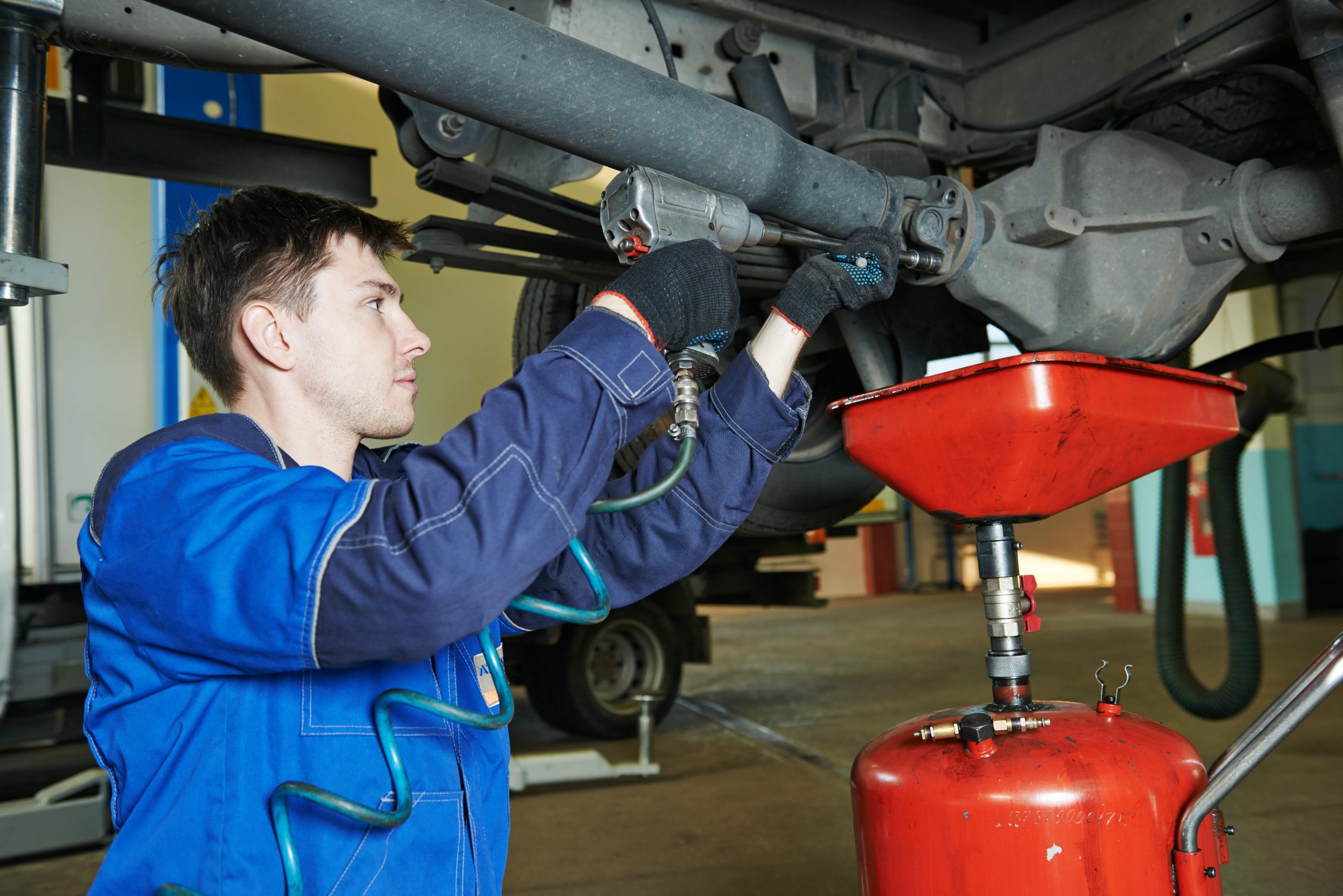 Mechanic repairing a work van