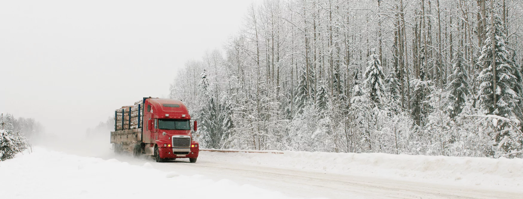 truck driving on the snowy highway