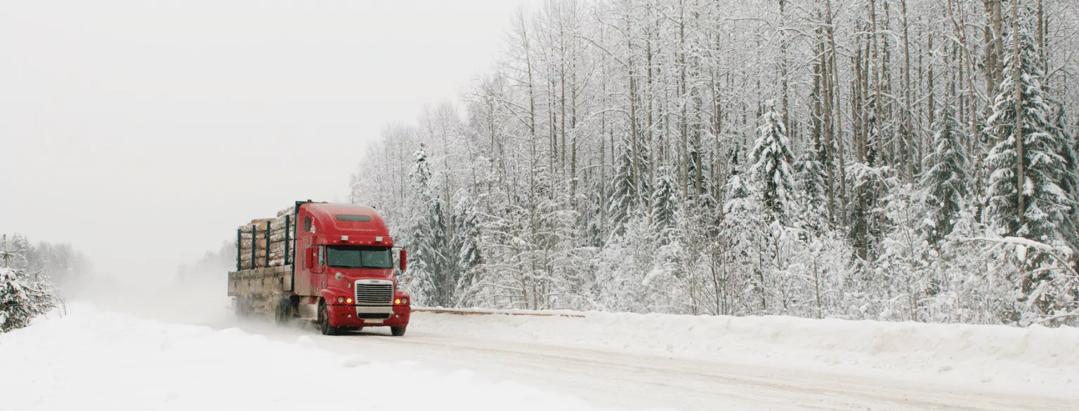 truck driving on the snowy highway